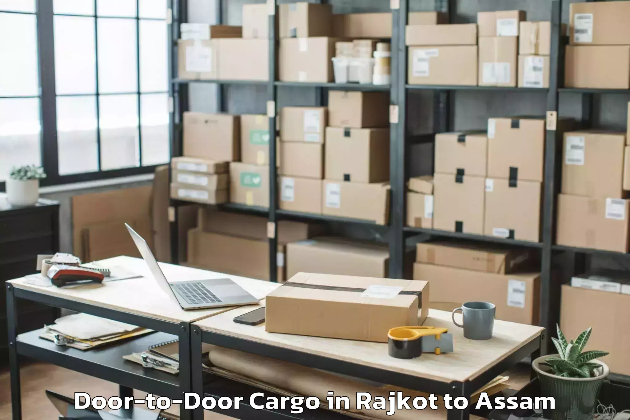 Expert Rajkot to Abhayapuri Door To Door Cargo